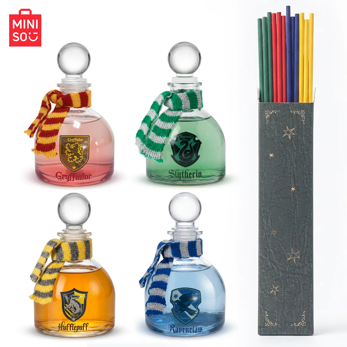 MINISO Harry Potter Magic Academy 4pc Reed Diffuser Set. Glass bottles with house scarves and fragrance oil sticks.