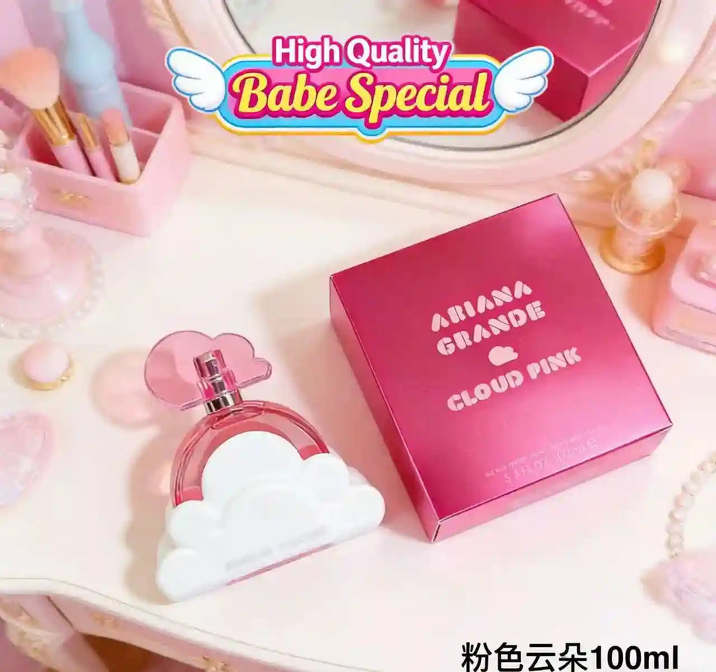 Ariana Grande Cloud Pink EDP 100ml perfume, iconic cloud-shaped bottle, ladies' fragrance on a vanity, pink aesthetic.